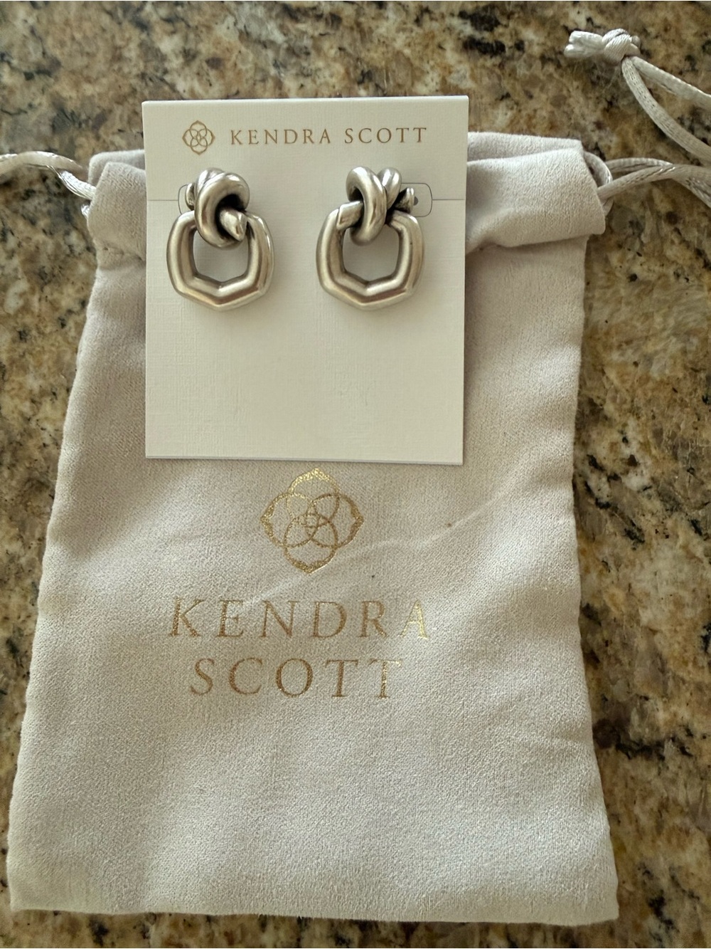 NEW!! Kendra Scott silver earrings. Never worn!!